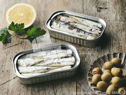 Image of open sardines cans