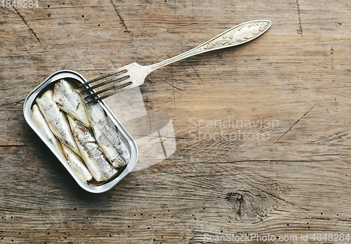 Image of open sardines can