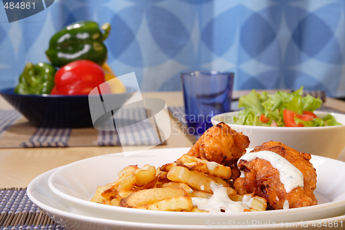Image of French fries and chicken