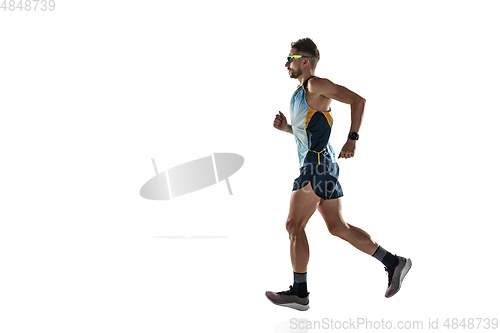 Image of Triathlon male athlete running isolated on white studio background