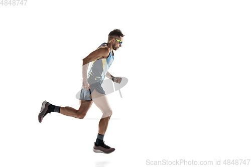 Image of Triathlon male athlete running isolated on white studio background