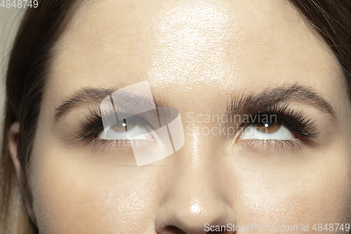 Image of Close up of face of beautiful caucasian young woman, focus on eyes