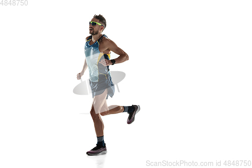 Image of Triathlon male athlete running isolated on white studio background