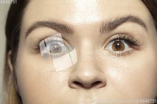 Image of Close up of face of beautiful caucasian young woman, focus on eyes