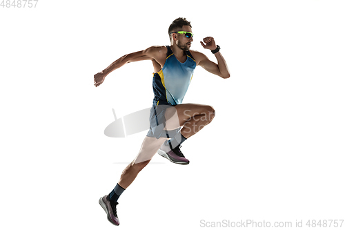 Image of Triathlon male athlete running isolated on white studio background