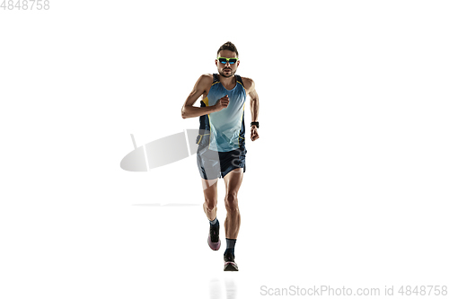 Image of Triathlon male athlete running isolated on white studio background