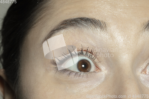 Image of Close up of face of beautiful caucasian young woman, focus on eyes