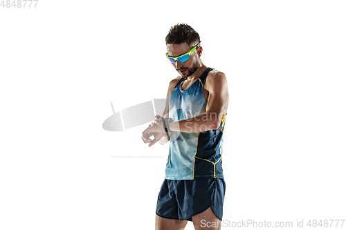 Image of Triathlon male athlete running isolated on white studio background