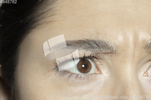 Image of Close up of face of beautiful caucasian young woman, focus on eyes