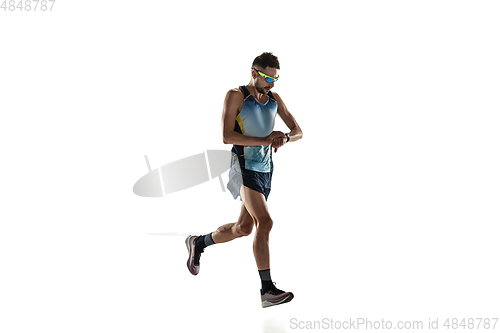 Image of Triathlon male athlete running isolated on white studio background