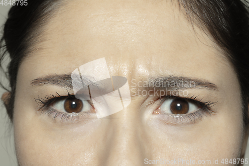 Image of Close up of face of beautiful caucasian young woman, focus on eyes