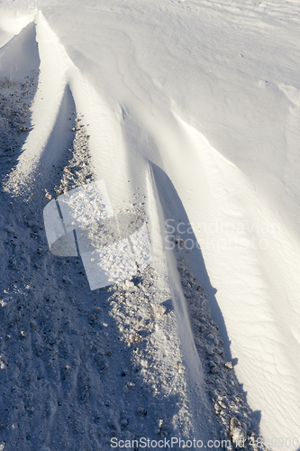 Image of snowdrifts with dirt