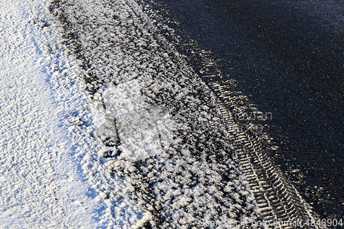 Image of Asphalt road under the snow