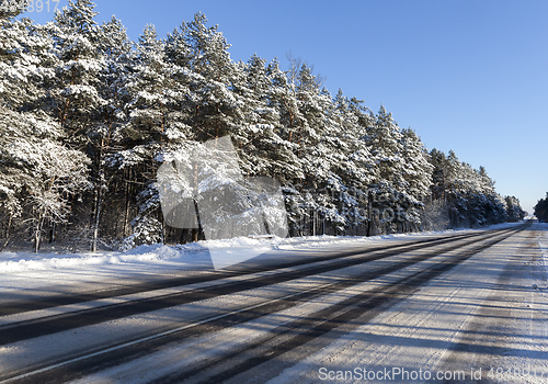Image of Road in winter ter season. Blue sky in the background