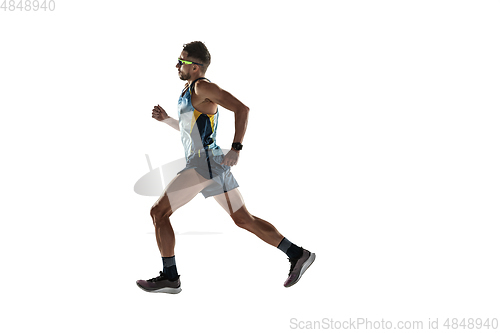 Image of Triathlon male athlete running isolated on white studio background