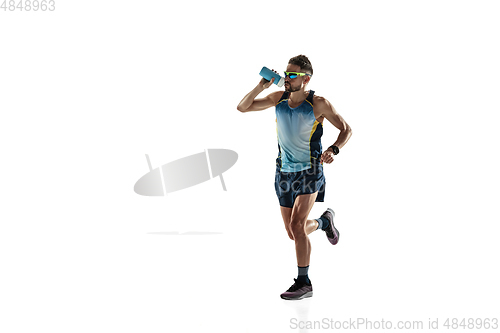 Image of Triathlon male athlete running isolated on white studio background