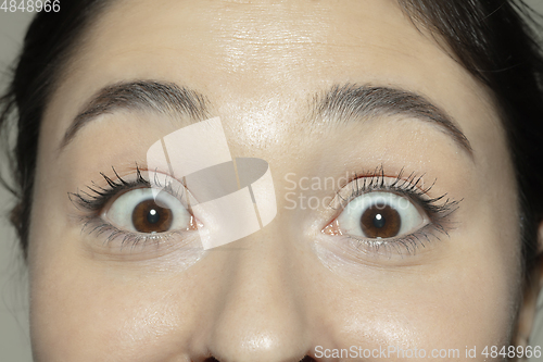 Image of Close up of face of beautiful caucasian young woman, focus on eyes