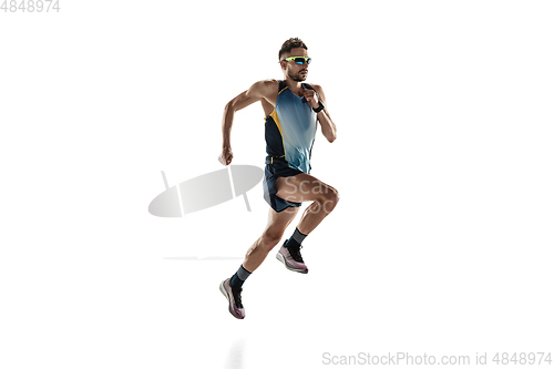 Image of Triathlon male athlete running isolated on white studio background