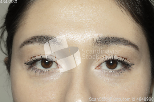 Image of Close up of face of beautiful caucasian young woman, focus on eyes