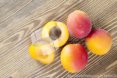 Image of four ripe apricots