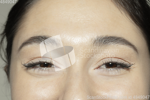 Image of Close up of face of beautiful caucasian young woman, focus on eyes