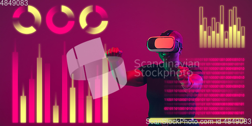 Image of Woman using interface modern technology and digital layer effect, VR-headset as business, finance, economics strategy concept