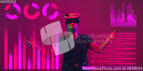 Image of Woman using interface modern technology and digital layer effect, VR-headset as business, finance, economics strategy concept