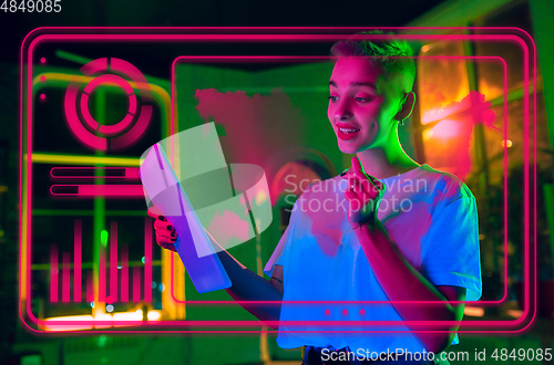 Image of Woman using interface modern technology and digital layer effect as business, finance, economics strategy concept