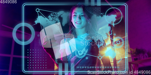 Image of Woman using interface modern technology and digital layer effect as business, finance, economics strategy concept