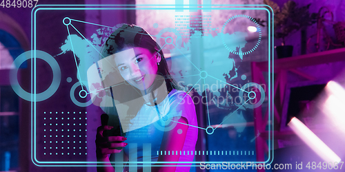 Image of Woman using interface modern technology and digital layer effect as business, finance, economics strategy concept