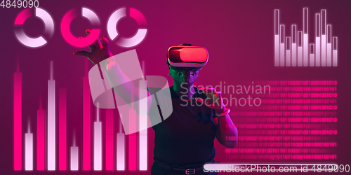 Image of Woman using interface modern technology and digital layer effect, VR-headset as business, finance, economics strategy concept