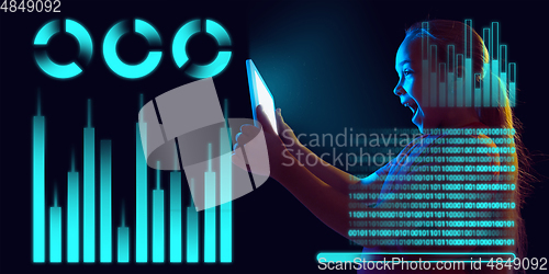 Image of Girl using interface modern technology and digital layer effect as business, finance, economics strategy concept