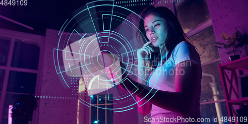 Image of Woman using interface modern technology and digital layer effect as business, finance, economics strategy concept