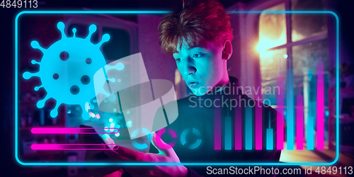 Image of Man using interface modern technology and digital layer effect as information of coronavirus pandemic spread