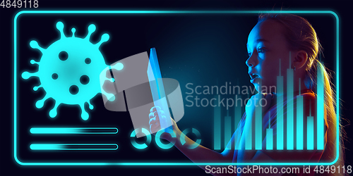 Image of Girl using interface modern technology and digital layer effect as information of coronavirus pandemic spread