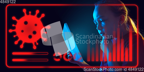 Image of Girl using interface modern technology and digital layer effect as information of coronavirus pandemic spread