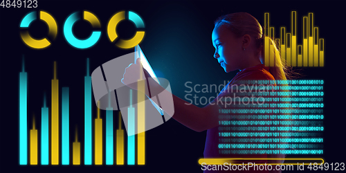 Image of Girl using interface modern technology and digital layer effect as business, finance, economics strategy concept