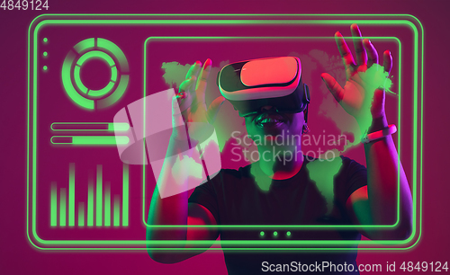 Image of Woman using interface modern technology and digital layer effect, VR-headset as business, finance, economics strategy concept