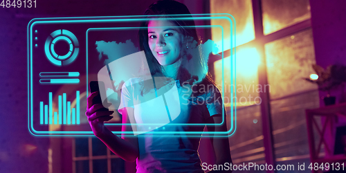 Image of Woman using interface modern technology and digital layer effect as business, finance, economics strategy concept