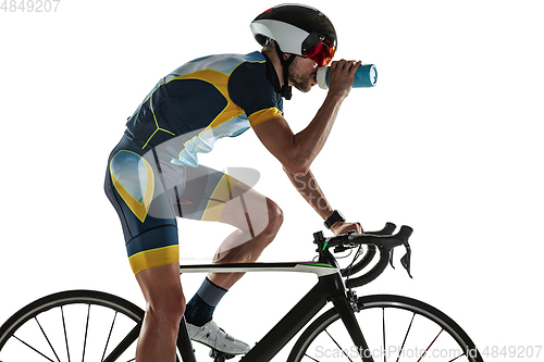 Image of Triathlon male athlete cycle training isolated on white studio background