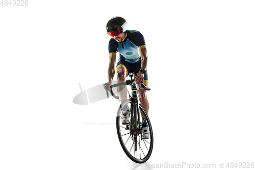 Image of Triathlon male athlete cycle training isolated on white studio background