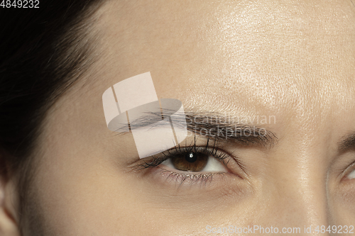 Image of Close up of face of beautiful caucasian young woman, focus on eyes