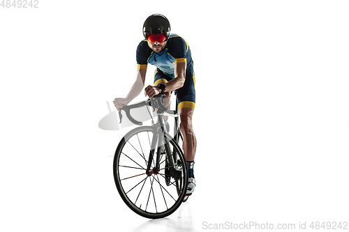 Image of Triathlon male athlete cycle training isolated on white studio background