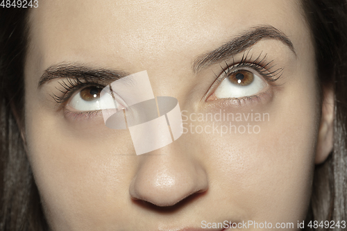 Image of Close up of face of beautiful caucasian young woman, focus on eyes