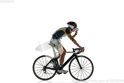 Image of Triathlon male athlete cycle training isolated on white studio background