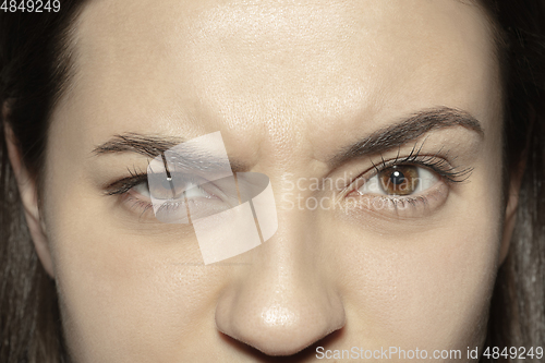 Image of Close up of face of beautiful caucasian young woman, focus on eyes