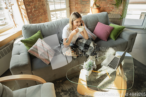 Image of Caucasian woman, freelancer during the work in home office while quarantine