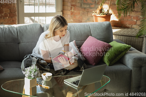 Image of Caucasian woman, freelancer during the work in home office while quarantine