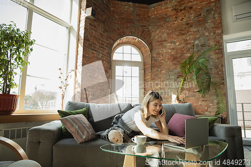 Image of Caucasian woman, freelancer during the work in home office while quarantine