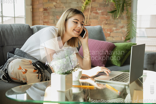 Image of Caucasian woman, freelancer during the work in home office while quarantine